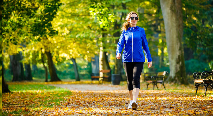 A woman walking in a park